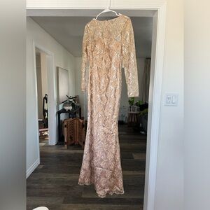Long sleeve embellished formal dress. Size 4 original price $248. New never worn